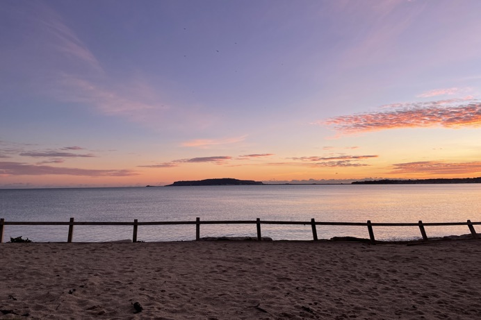 Direct beach access from southside green to bowleaze cove beach at sunset with views of Portland and the bay