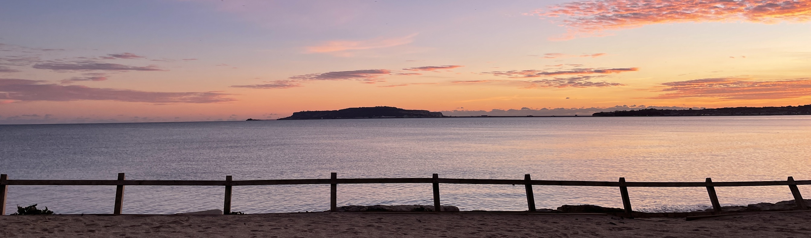 Direct beach access from southside green to bowleaze cove beach at sunset with views of Portland and the bay
