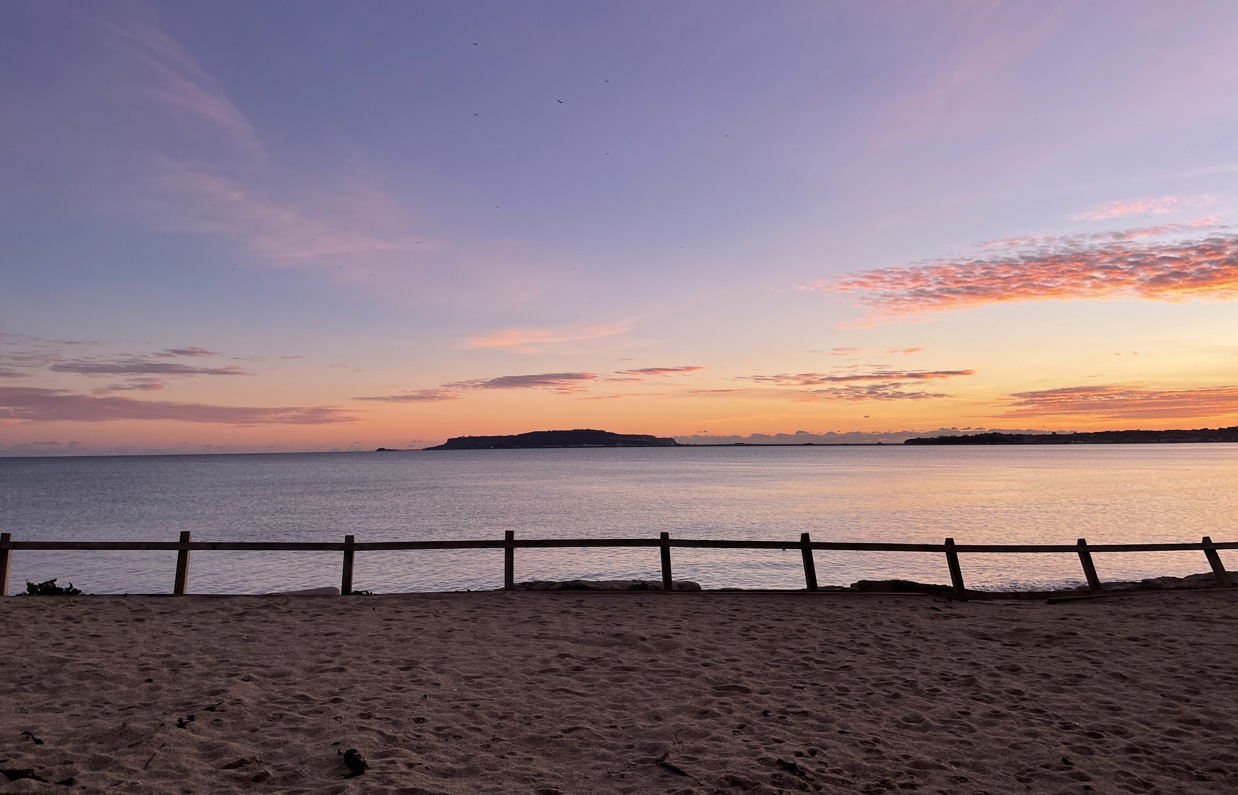 Direct beach access from southside green to bowleaze cove beach at sunset with views of Portland and the bay