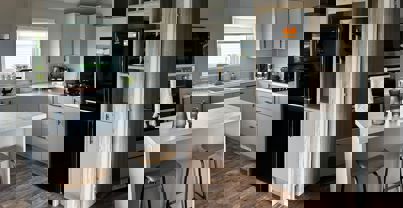 Modern white and cream kitchen with breakfast bar island