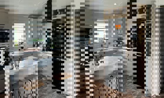 Modern white and cream kitchen with breakfast bar island