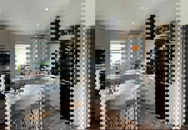 Modern white and cream kitchen with breakfast bar island