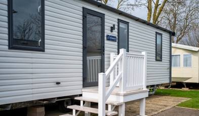 External of a caravan on pitch with steps