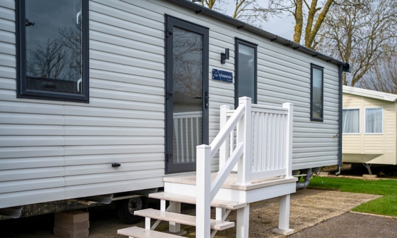 External of a caravan on pitch with steps
