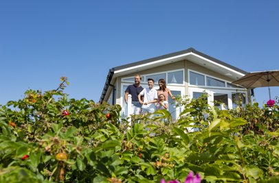 Family on deck of Chesil Beach Holiday Home