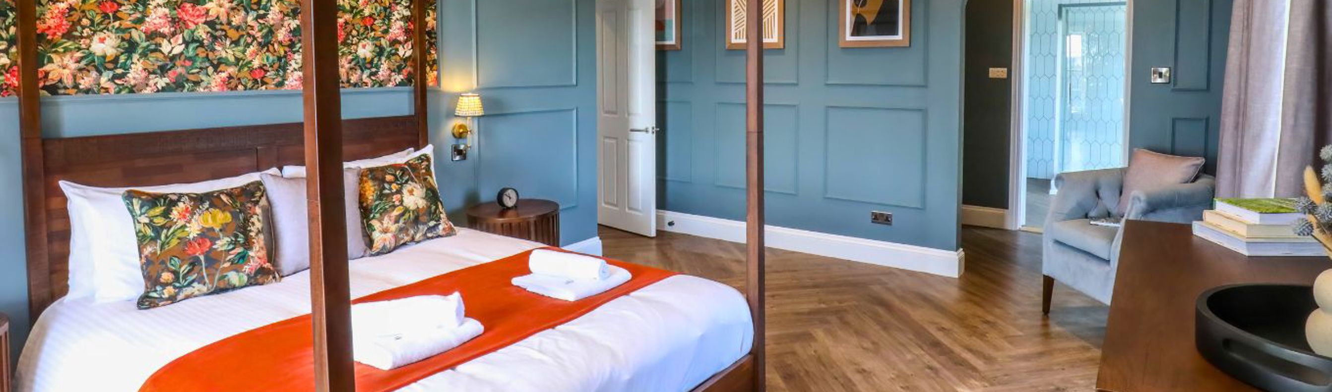 Internal of a manor house master bedroom with four poster bed and ensuite