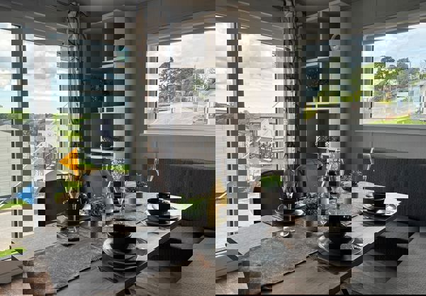 Dining table with L-shaped banquet seating set for dinner for four