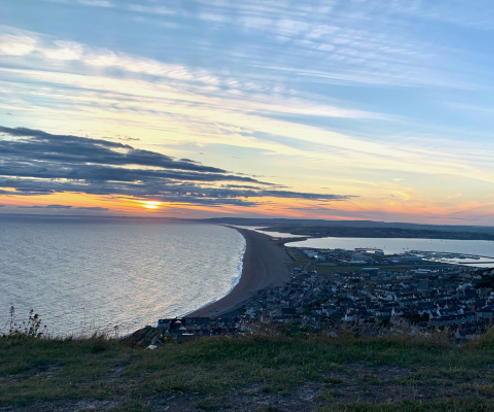 View of Chesil Beach and Surrounding Area at Sunset from Portland