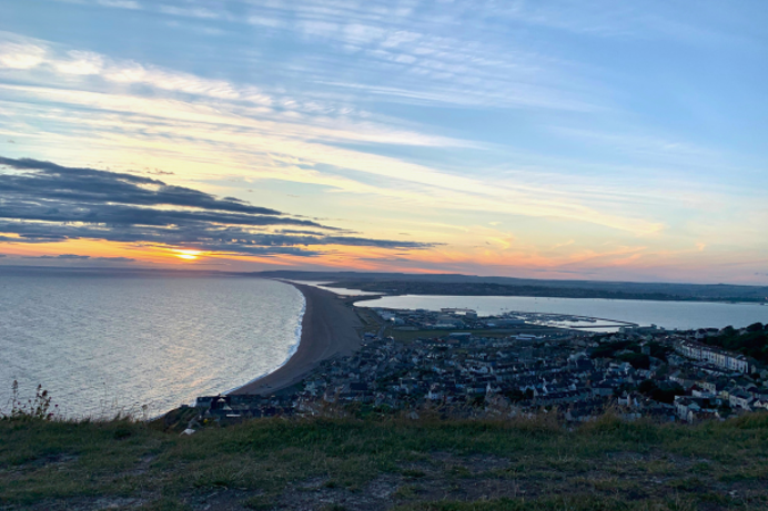 View of Chesil Beach and Surrounding Area at Sunset from Portland