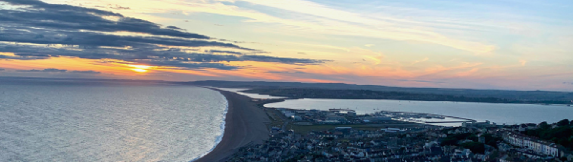 View of Chesil Beach and Surrounding Area at Sunset from Portland