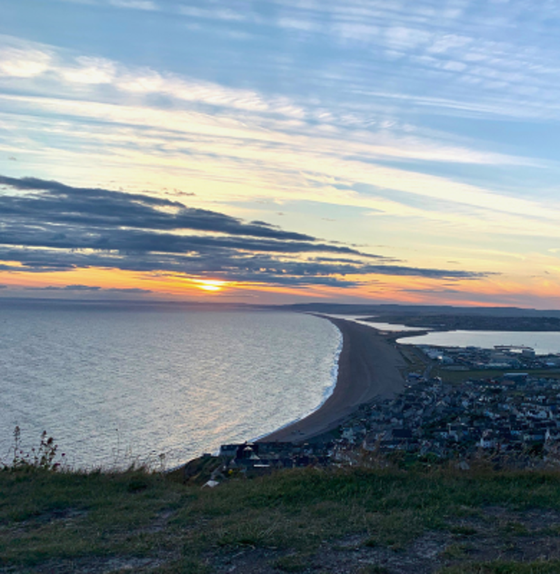 View of Chesil Beach and Surrounding Area at Sunset from Portland