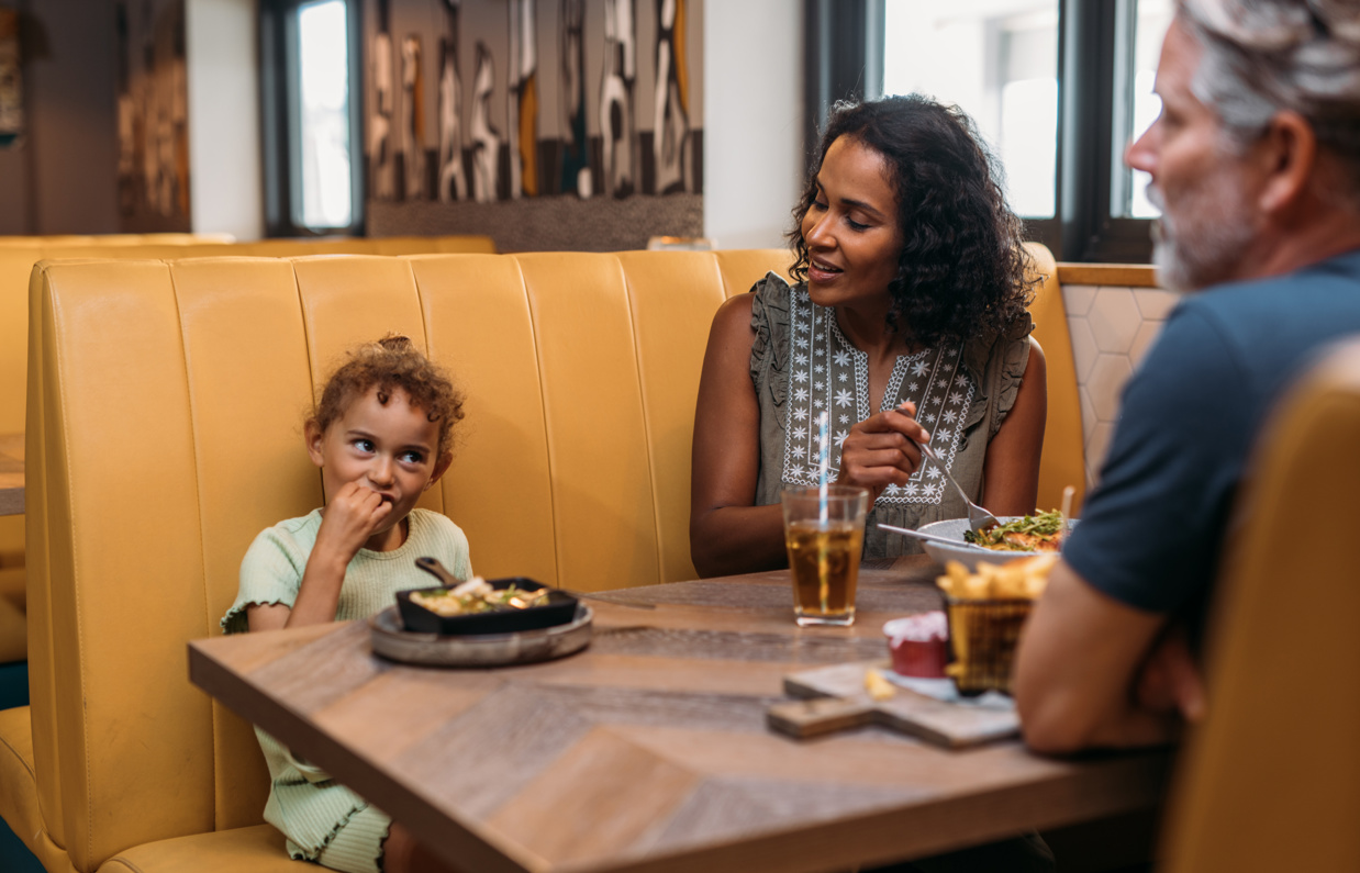 Family sharing a meal at a restaurant