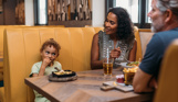 Family sharing a meal at a restaurant