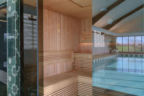 The Barn Sauna with reflection of pool on window