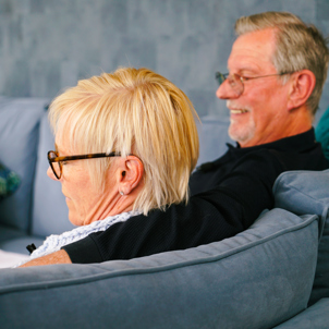 A couple sat on a sofa together