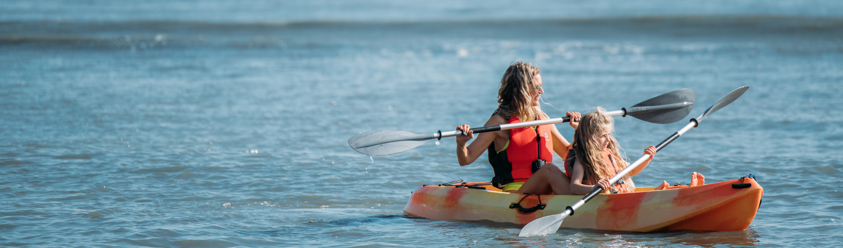 Mother and Daughter kayaking in bowleaze cove