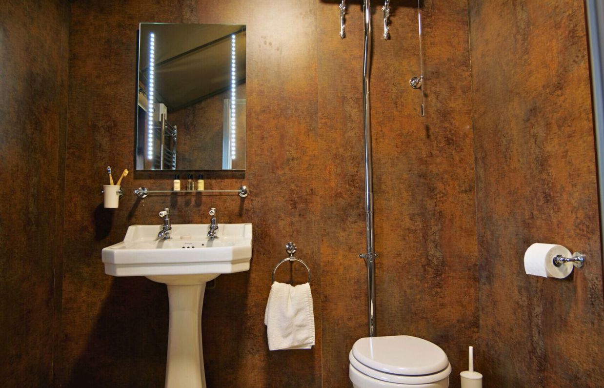 Internal of safari tent bathroom with sink and toilet