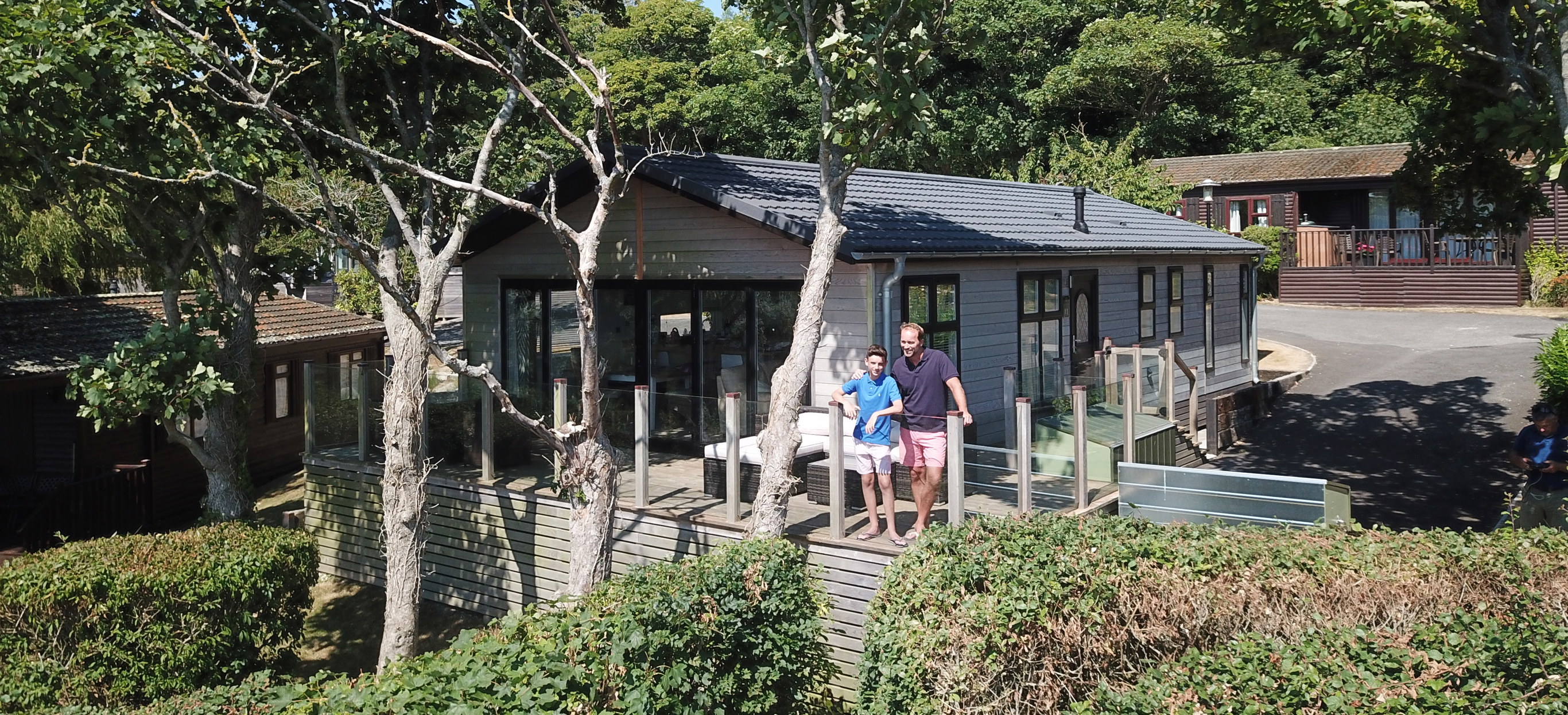 Father and son enjoy the view from their lodge