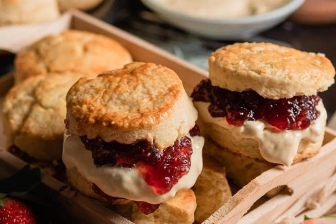 A selection of classic British scones filled with jam and cream
