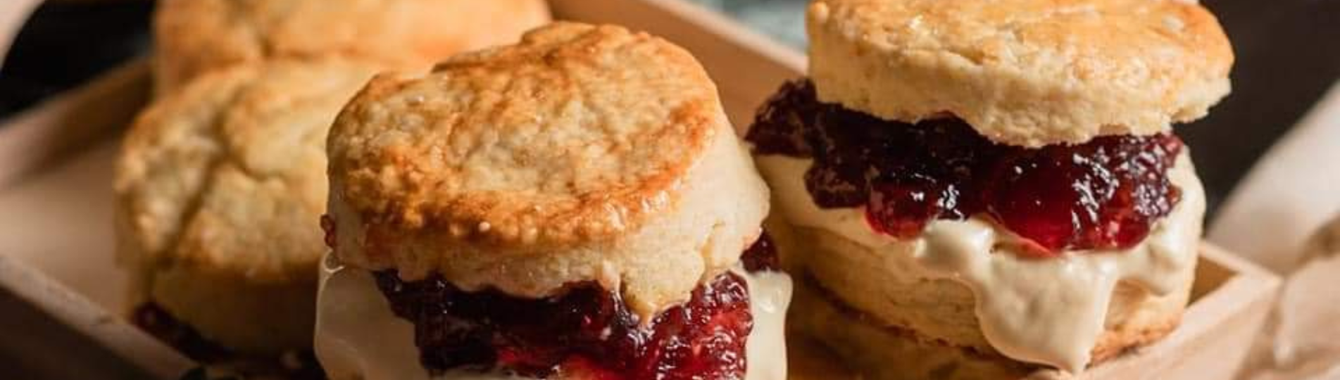 A selection of classic British scones filled with jam and cream