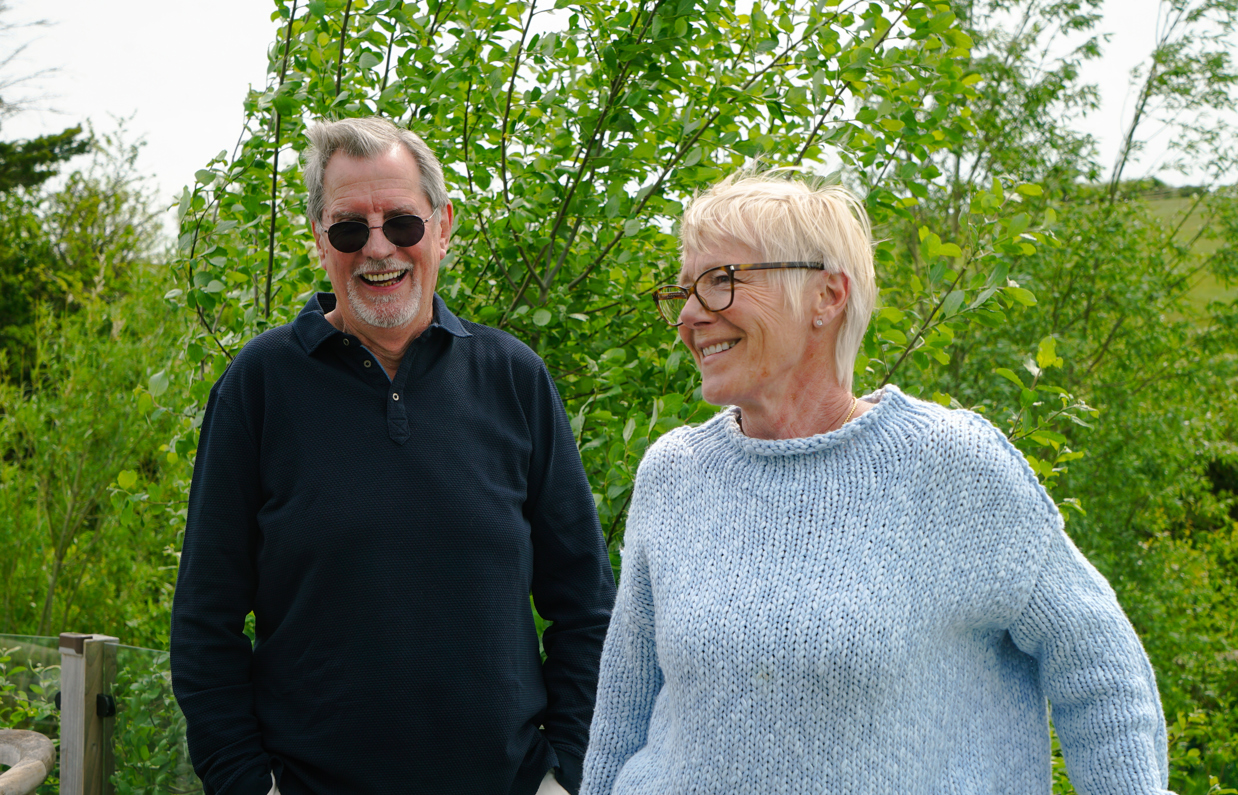 Stables Owners smiling on deck