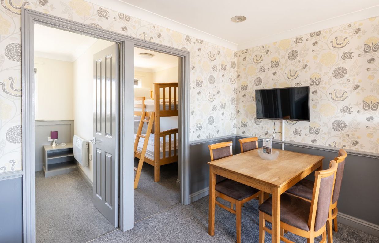 Open plan living space in Chesil Beach apartments including bedrooms