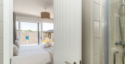 Internal of a cabin master bedroom with ensuite