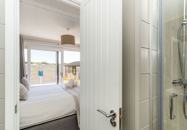 Internal of a cabin master bedroom with ensuite