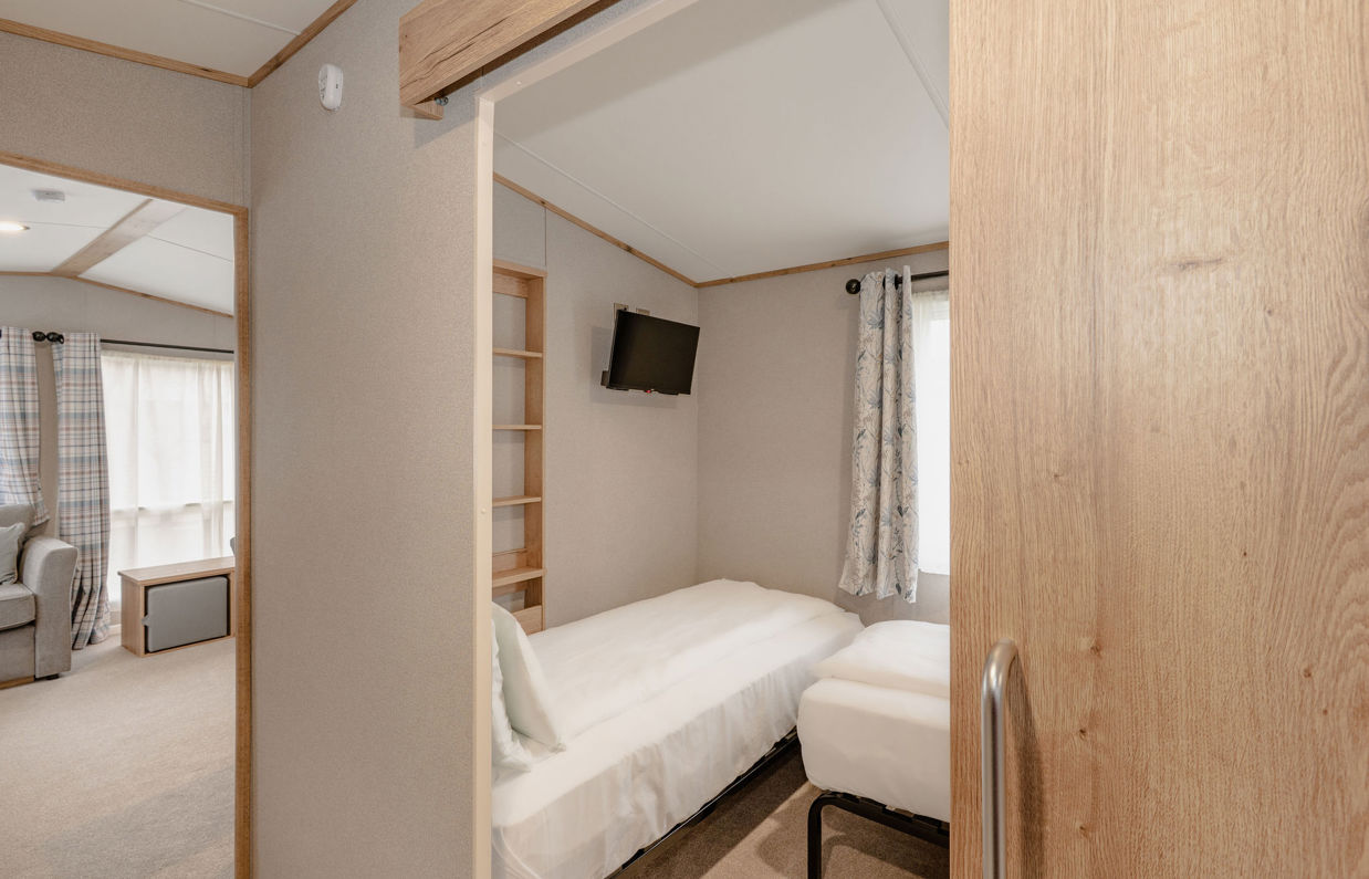 Internal of an accessible caravan spacious twin bedroom 