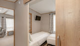 Internal of an accessible caravan spacious twin bedroom 