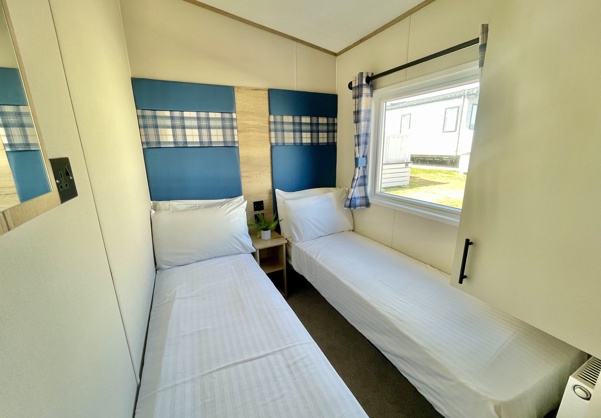 Internal of a caravan twin bedroom
