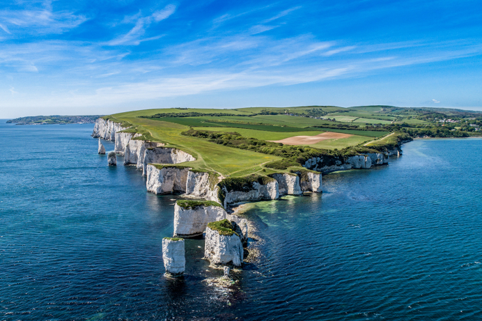 A section of the Jurassic Coast with white chalk cliffs in the blue sea