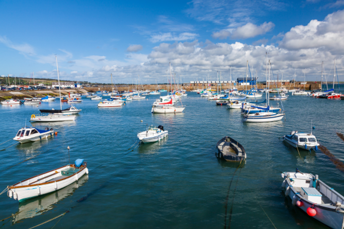 View of a harbour area with boats and blue skies