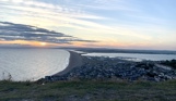The view of Weymouth and Chesil Beach from Portland Heights at sunset