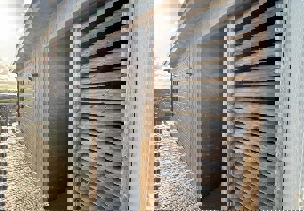 Side of lodge from decking