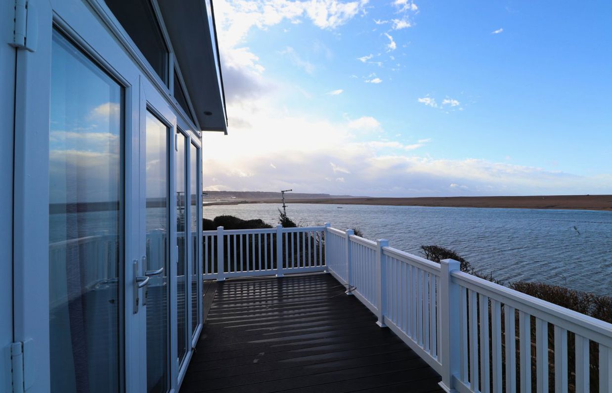 View from decking of sea and Chesil Beach