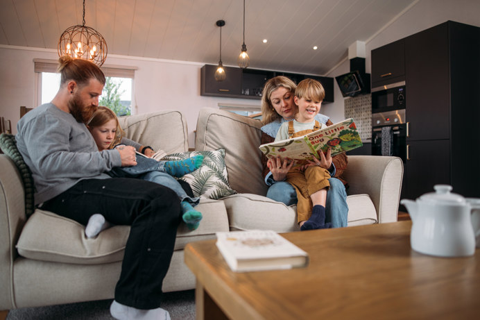 Family reading time in holiday home