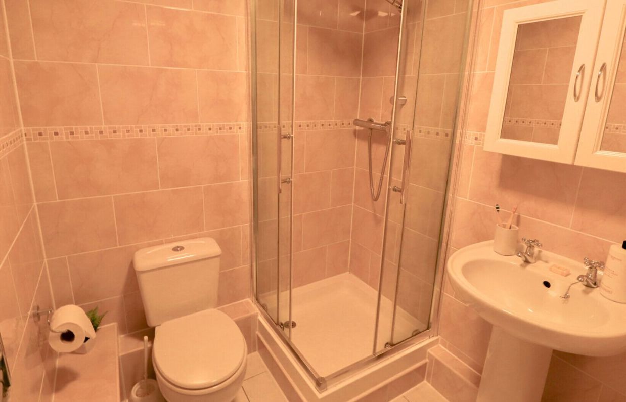 Internal of a cottage bathroom with shower, toilet and sink