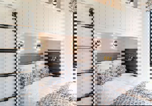 Interior of a Super Lodge Twin Bedroom with a Bunk Bed Overhead, sleeping 3