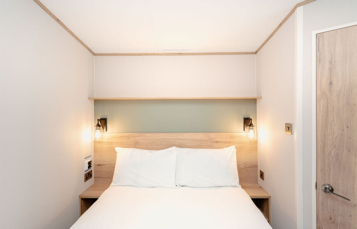 Internal of a caravan double bedroom with ensuite