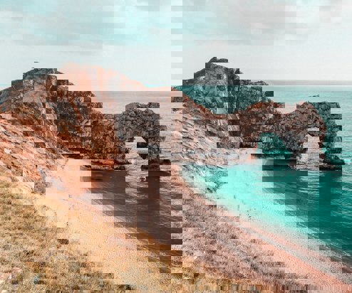 A dramatic limestone arch on the coast, Durdle Door