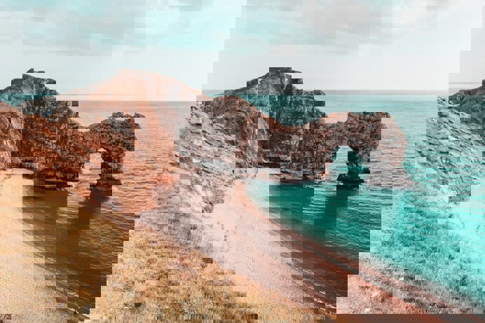 A dramatic limestone arch on the coast, Durdle Door