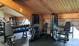 Inside of a modern gym facility with various equipment