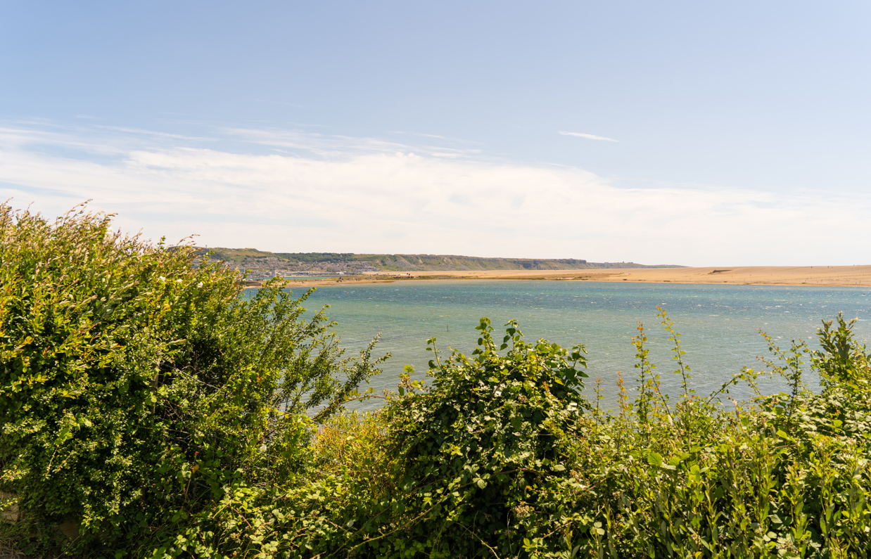 A view of the sea, Chesil Beach and Portland from the South West Coast Path