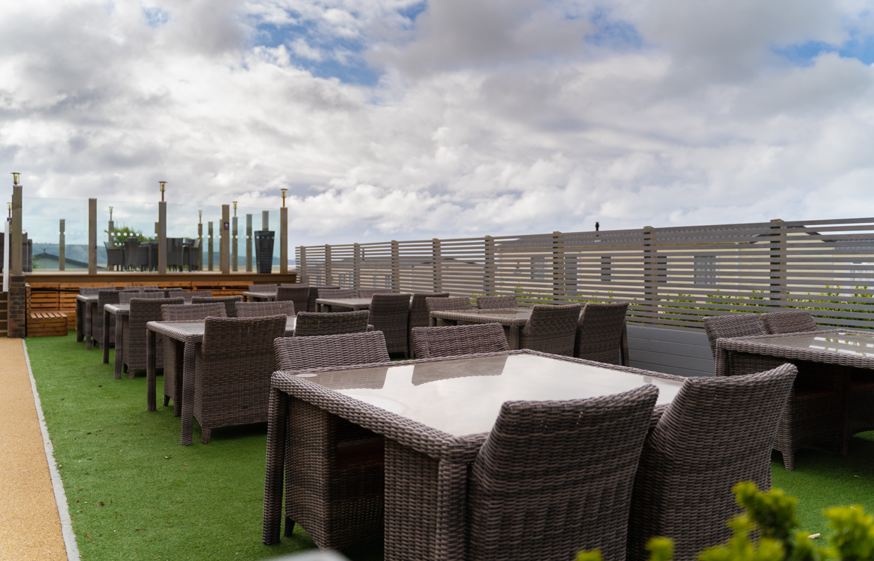 Breeze Bar & Grill outdoor seating with chairs and tables