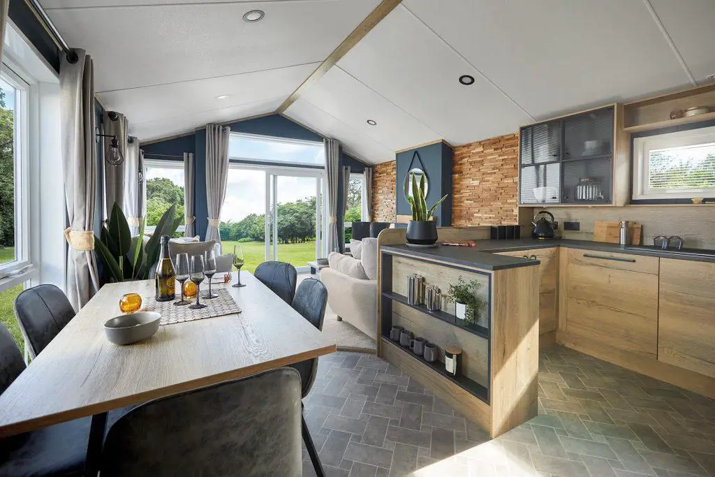 Open plan kitchen diner looking through to lounge with open windows