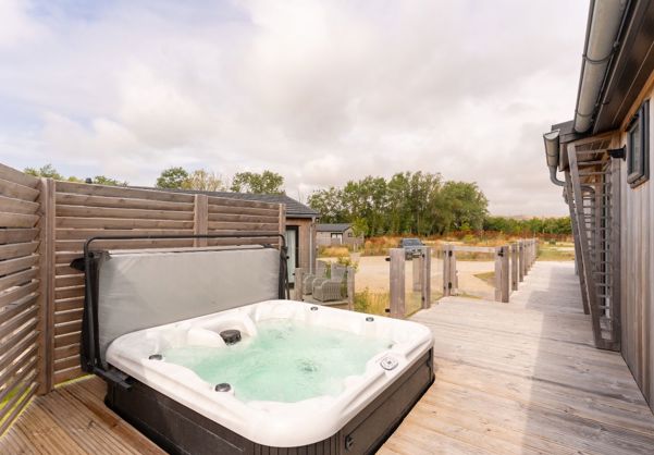 External of a luxury lodge with hot tub