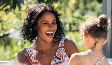 Family in hot tub surrounded by trees