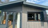 External of a lodge on pitch with decking and sliding windows