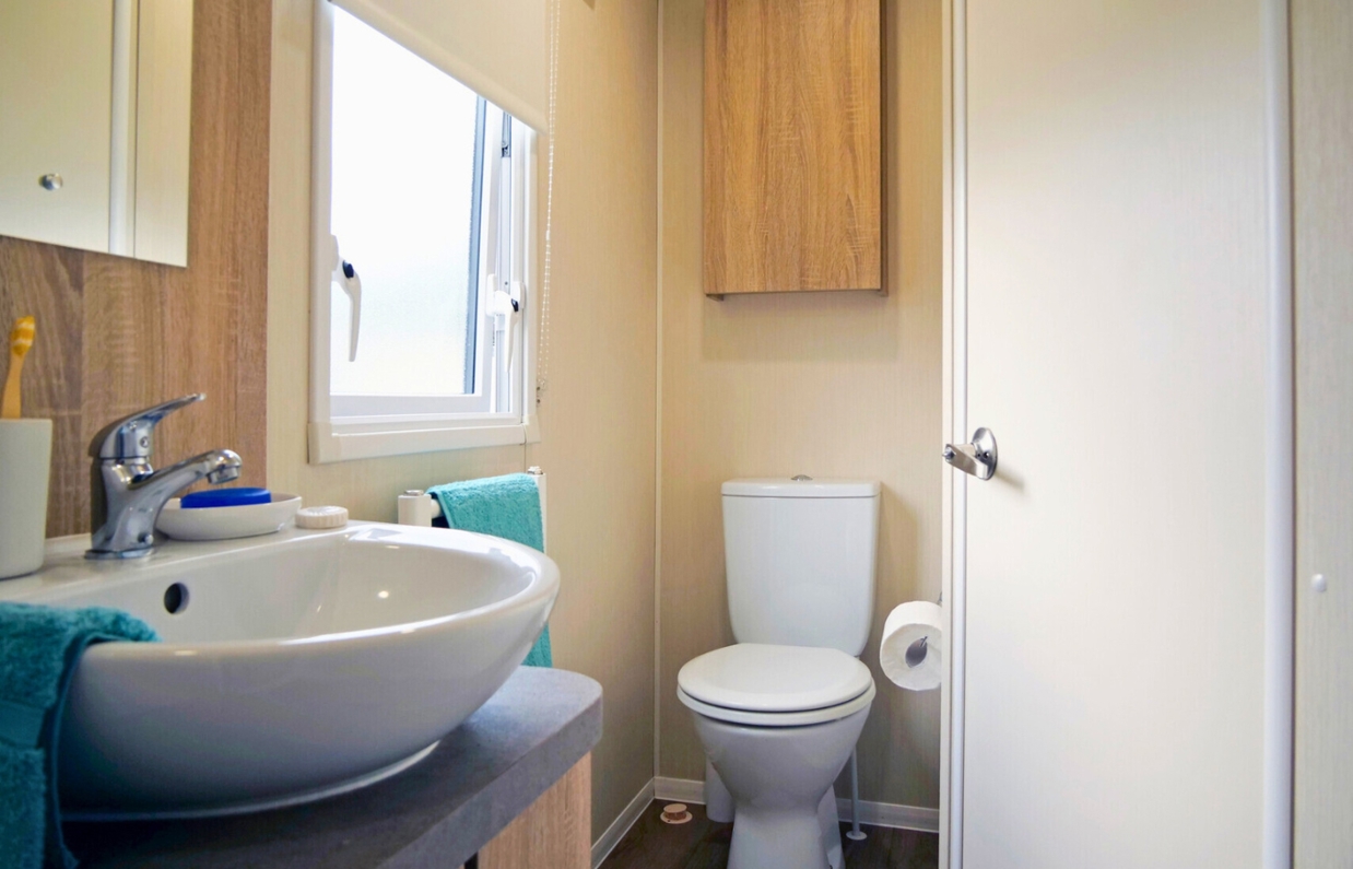 Internal of a caravan bathroom with toilet and sink